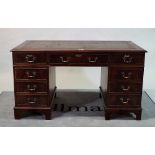 An early 20th mahogany pedestal desk