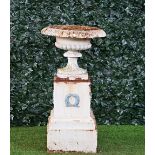 A Victorian white painted cast iron garden urn.