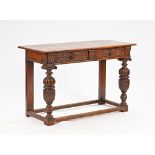 A 17th century style carved oak serving table, with pair of frieze drawers on cup and cover...