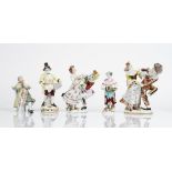 A group of Continental porcelains, late 19th/20th century, comprising; two groups of Harlequin...