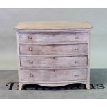 A modern grey painted bowfront chest of four long graduated drawers