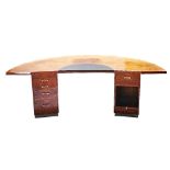 A large modern figured walnut semi-elliptic pedestal desk.