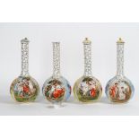 A pair of Victoria China yellow-ground bottle vases, early 20th century, each printed with...