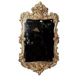 A 19th century white painted and silvered mirror with moulded bird decoration to upper and...