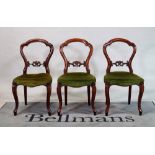 A set of seven Victorian mahogany dining chairs