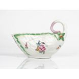 A Derby porcelain leaf moulded sauceboat, circa 1760-65, painted with scattered flowers, set...