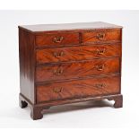 A George III mahogany chest of two short and three long graduated drawers on bracket feet,...