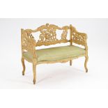 A Rococo Revival distressed painted small square back sofa with pierced decoration and...
