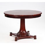 A Regency style circular stella veneered mahogany centre table, on flared fluted column, 112cm...