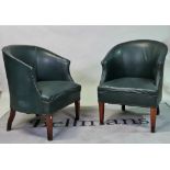 A pair of early 20th century oak framed tub chairs on tapering square supports