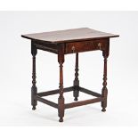 A 17th century oak single drawer side table, on turned supports, united by perimeter stretcher...