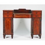 A Regency Scottish mahogany pedestal sideboard with a central bow drawer flanked by four short...