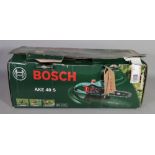 A Bosche AKE 40 S electric chainsaw.