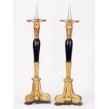 A pair of gilt gesso and black painted pricket sticks