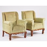 A pair of beech framed square back easy armchairs on carved scroll supports, 84cm wide x 97cm...