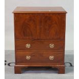 A George III mahogany side cupboard with single drawer base on bracket feet