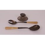 A pair of silver salad servers and a silver inkwell, (2).