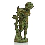 A patinated bronze sculpture of a boy