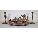 Silver plated wares including, an oval galleried tray, a pair of candlesticks and a four place...