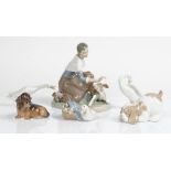 A Lladro group of a milkmaid and calf, 21cm. high; also a Lladro group of a duck with...