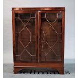 A George III mahogany side cabinet with astragal glazed doors