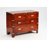 A brass bound mahogany Campaign style chest of two short and two long graduated drawers on...
