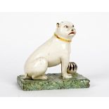 A Continental earthenware figure of a pug dog