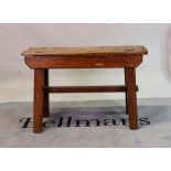 A 19th century elm and pine rustic low side table on block supports