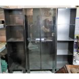A modern black painted hardwood triple section display cabinet