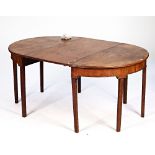 A George III mahogany D-end dining table on tapering square supports with one extra leaf,...