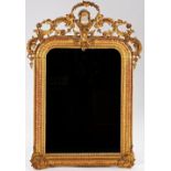 A 19th century French gilt framed wall mirror with painted female bust crest and ribbed frame,...