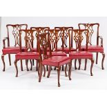 A set of eight George III style mahogany dining chairs, with pierced splat on cabriole...