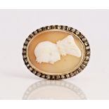 A shell cameo and diamond brooch.