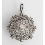 A diamond pendant brooch, circa 1900, of shaped circular form, the centre cluster mounted with...