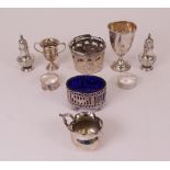 Silver, comprising; a cream jug, two trophy cups, napkin ring and two pepperettes, combined...