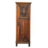 A Gothic Revival oak single door wardrobe, with carved linen fold decoration, 65cm wide x...