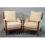 'Wesley Barrell', a pair of modern stained beech framed armchairs on turned supports