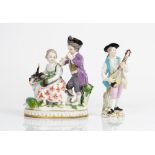 A Meissen group of vintners, late 19th century, modelled with girl seated on the back of a...