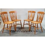 A set of six modern beech and ash stick back dining chairs
