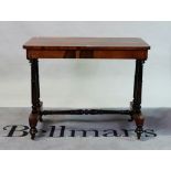 A William IV rosewood centre table on turned supports united by 'H' frame stretcher