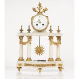 An Empire style ormolu and white marble mantel clock