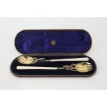 A pair of Victorian silver salad servers