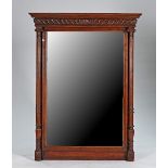 A late 19th century French oak mirror, with gadrooned frieze and fluted columns, 115cm wide x...