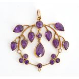 A gold, amethyst and seed pearl set pendant, in an openwork design, mounted with pear shaped...