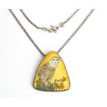 A silver and enamelled pendant with a neckchain.