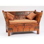 An Indian iron bound teak splayed square back sofa with lift box seat on block supports, 171cm...