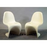 Probably Verner Panton, two one piece moulded, white plastic chairs