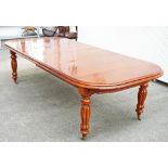 An early Victorian style mahogany extending dining table (3).