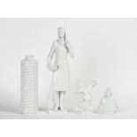 Four items of Meissen white glazed porcelain, 20th century, comprising; a figure of a woman...