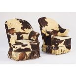 A pair of early 20th century French, later cow hide upholstered, tub back easy armchairs on...